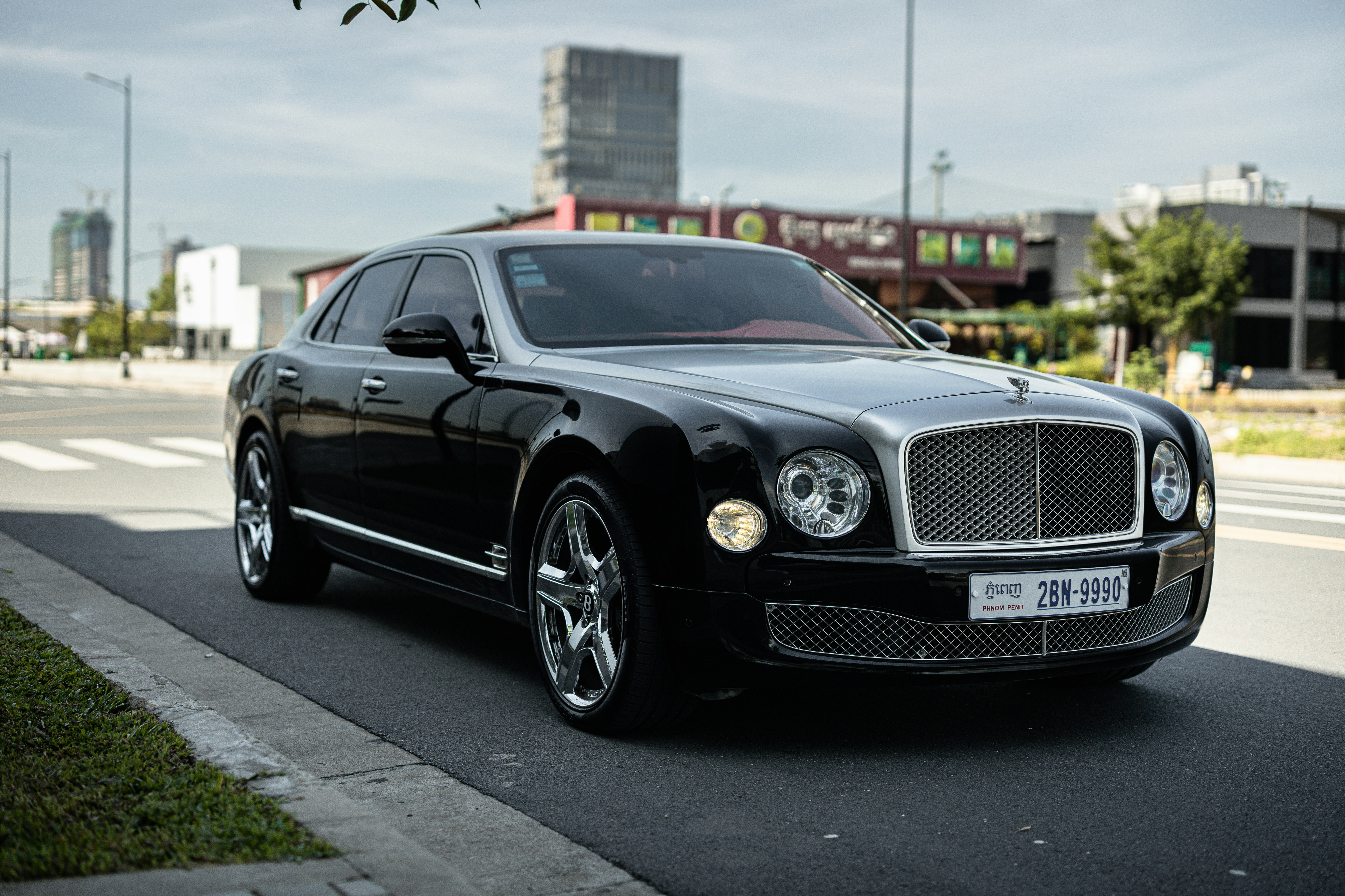 black mercedes benz coupe on road during daytime